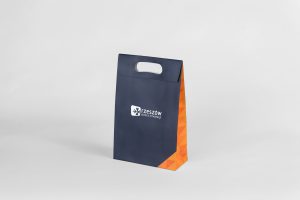 Granatowa torba papierowa z pomarańczowym bokiem - sztancowany uchwyt, klapka